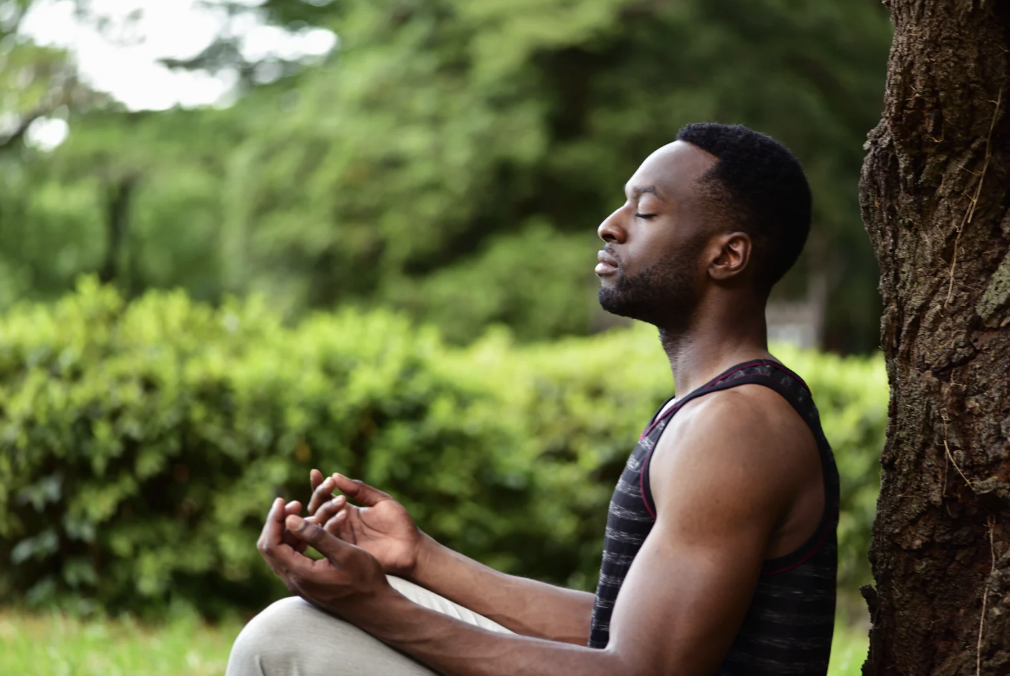 Man practicing mindfulness meditation and mindful breathing